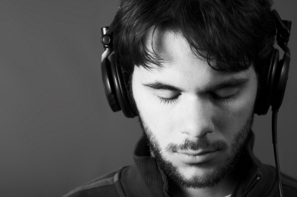 man_listening_to_headphones_with_eyes_closed